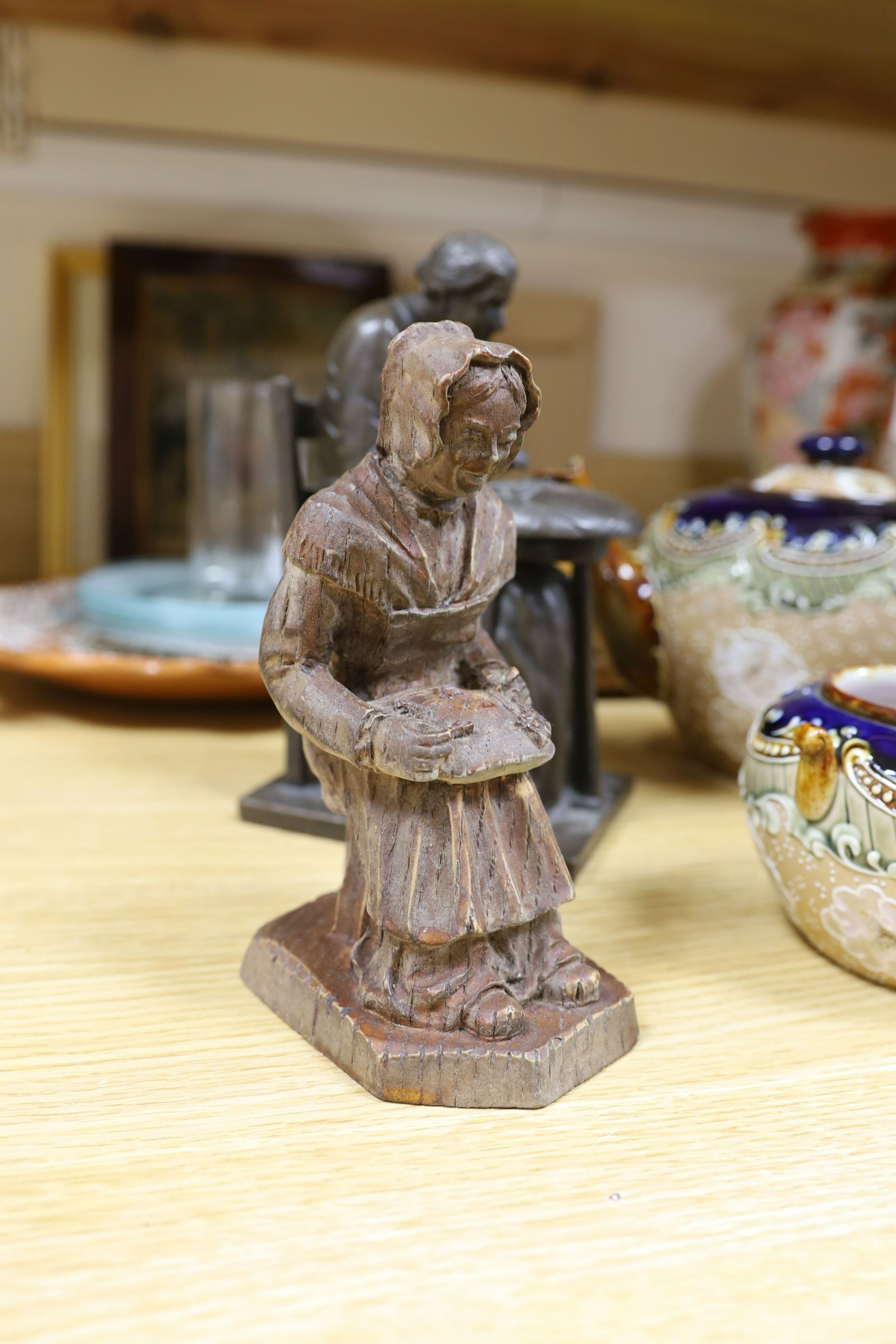 A cold cast bronze, Bobbin lace maker, similar carved wood figure, ceramic lace-pattern dish etc